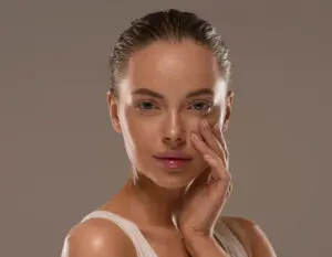 Beauty woman with hands healthy natural make up clean fresh ski